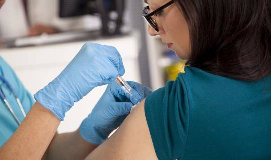 Woman getting vaccine