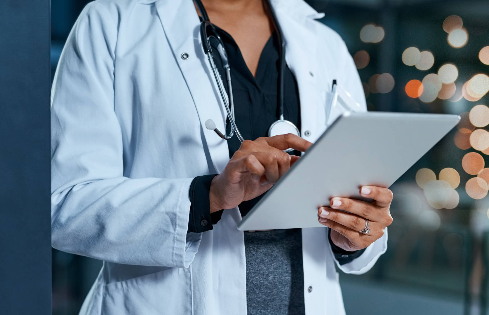 Doctor looking at iPad